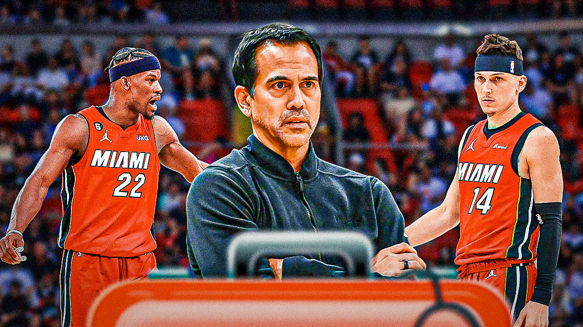 Miami Heat head coach Erik Spoelstra in the middle with Jimmy Butler and Tyler Herro on either side with injury signs around him in front of Kaseya Center.