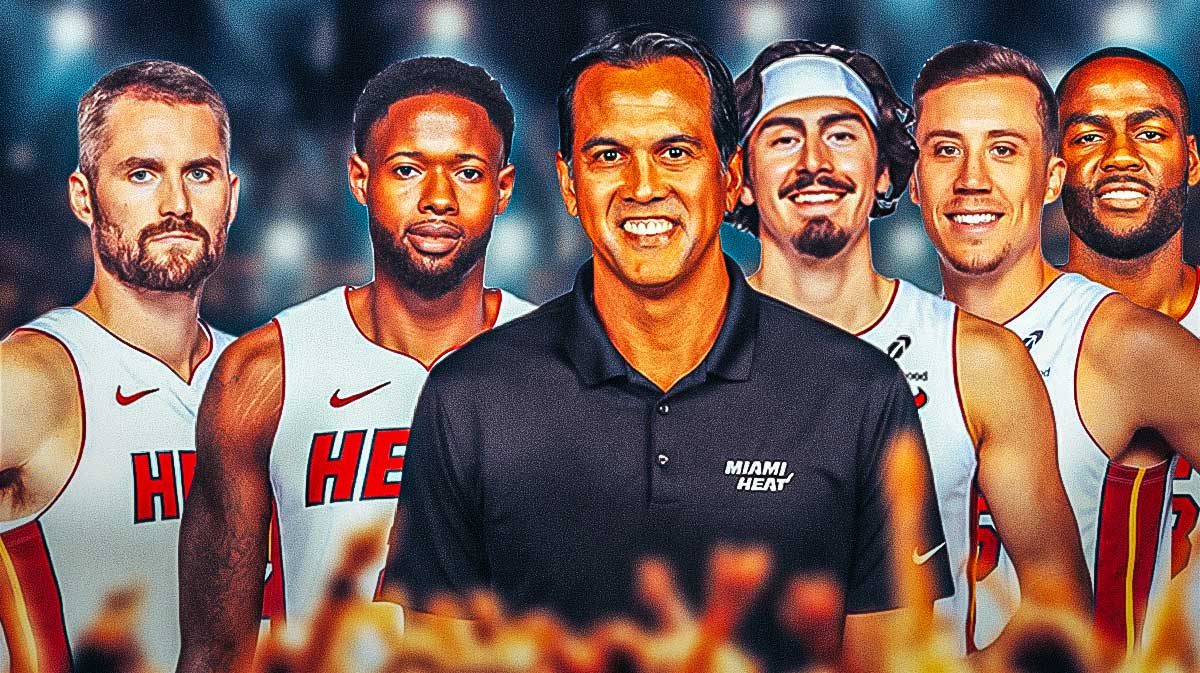 Miami Heat head coach Erik Spoelstra in the middle with Haywood Highsmith, Kevin Love, Jaime Jaquez Jr., Duncan Robinson, and Alec Burks on either side in front of Kaseya Center.