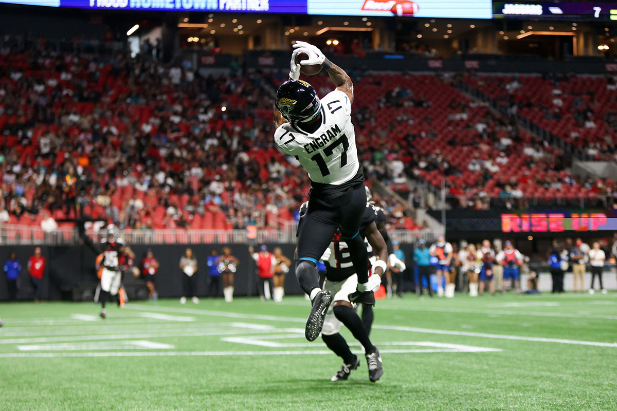 Jacksonville Jaguars tight end Evan Engram (17) catches a touchdown pass past Atlanta Falcons cornerback Anthony Johnson (43) in the second quarter at Mercedes-Benz Stadium.