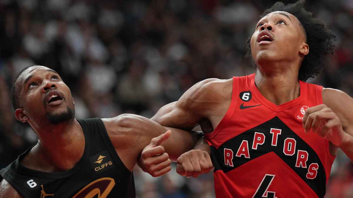Toronto Raptors forward Scottie Barnes (4) battles for the ball with Cleveland Cavaliers center Evan Mobley (4) during the fourth quarter at Scotiabank Arena.