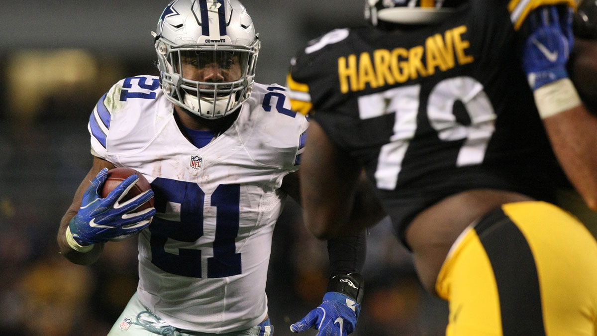 Dallas Cowboys running back Ezekiel Elliott (21) runs the ball against Pittsburgh Steelers dfensive tackle Jason Hargrave (79) during the second half of their game at Heinz Field. The Cowboys won the game, 35-30.