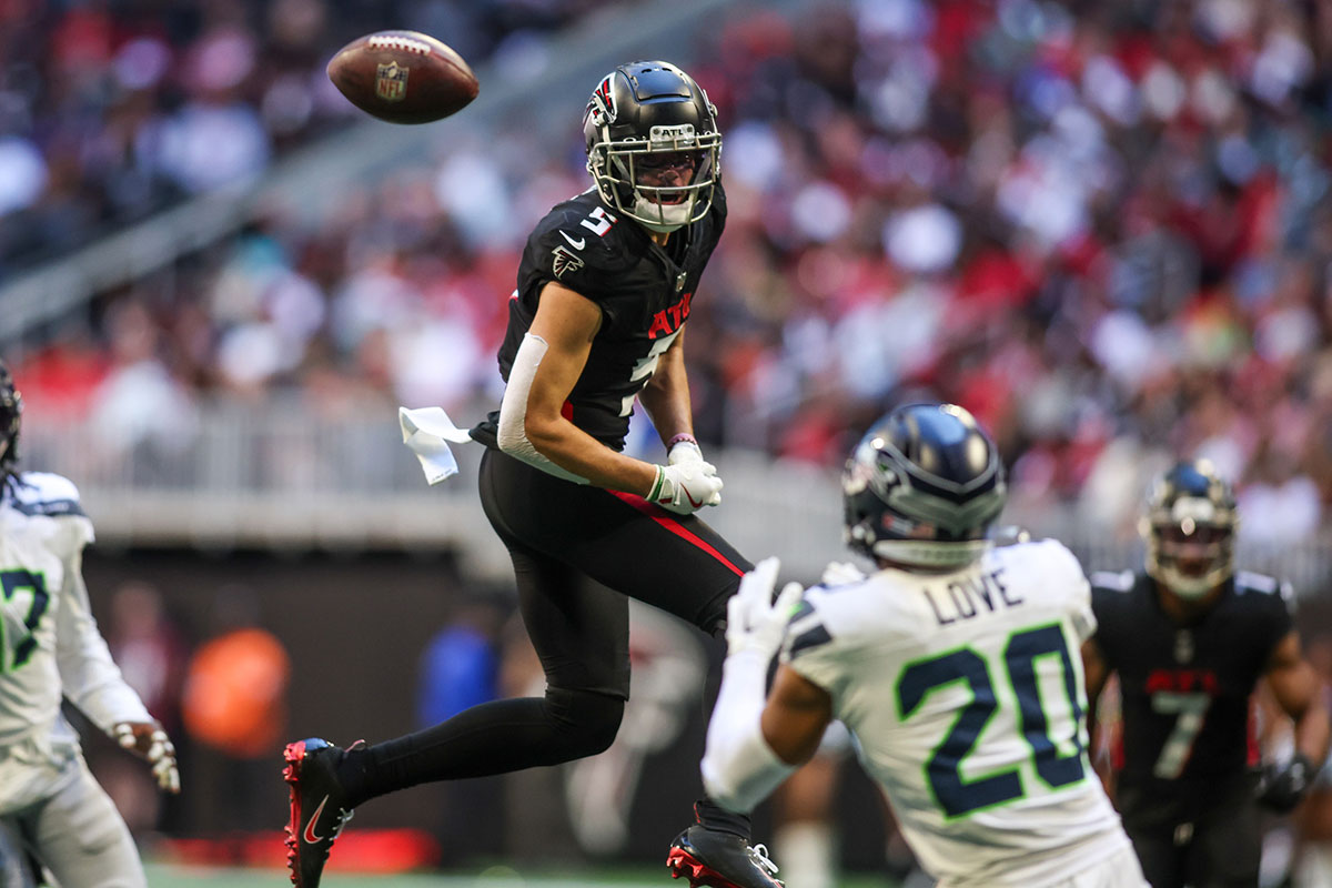 Oct 20, 2024; Atlanta, Georgia, USA; Atlanta Falcons wide receiver Drake London (5) tips a ball that is intercepted by Seattle Seahawks safety Julian Love (20) in the fourth quarter at Mercedes-Benz Stadium. Mandatory Credit: Brett Davis-Imagn Images