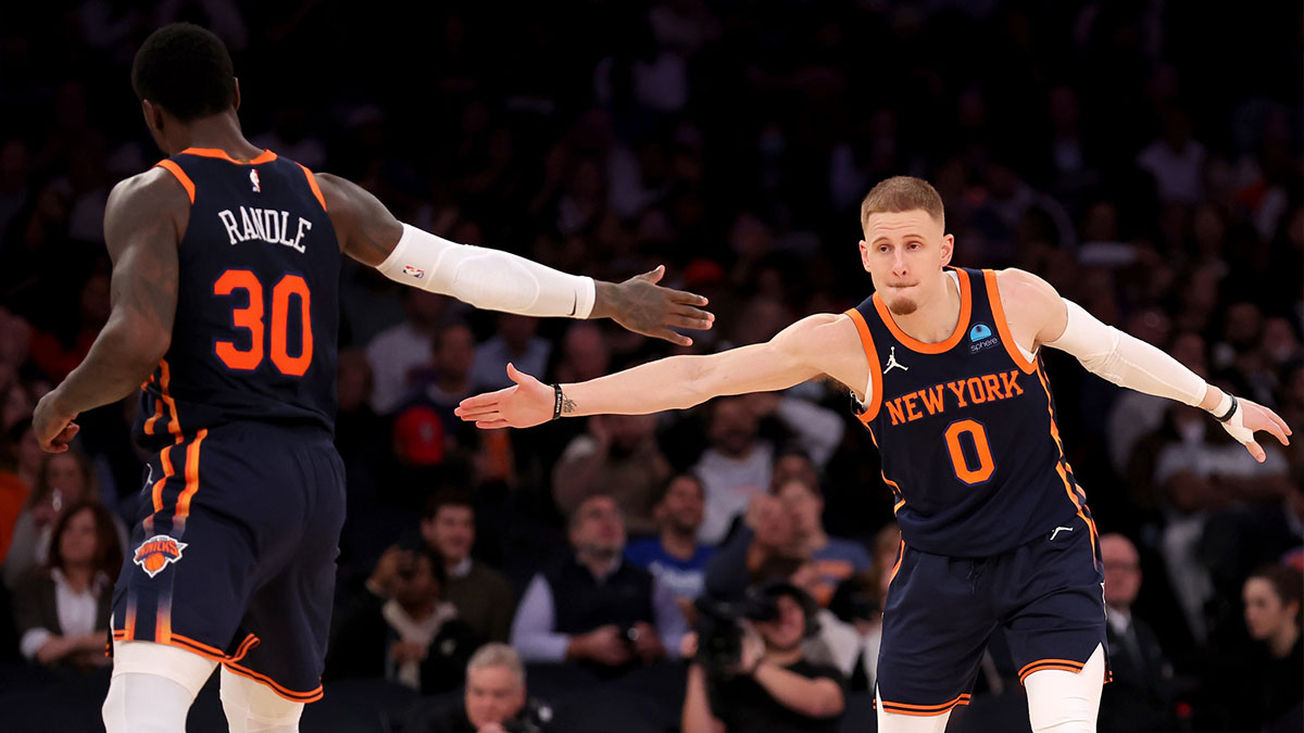 Knicks guard Donte DiVincenzo (0) high fives forward Julius Randle (30) during the third quarter against the Denver Nuggets at Madison Square Garden