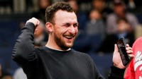 Former Texas A&M Heisman Trophy-winning quarterback Johnny Manziel cheers on the Aggies during the first round game between Texas A&M and Nebraska in the 2024 NCAA Tournament at FedExForum in Memphis, Tenn., on Friday, March 22, 2024.
