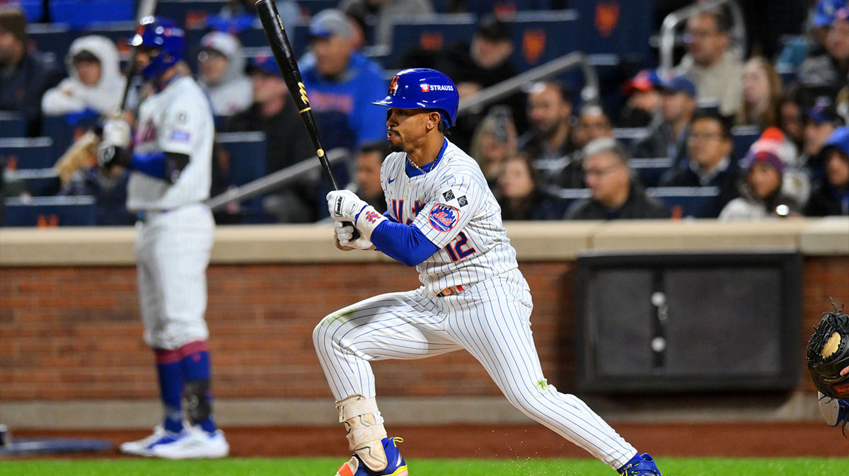 New York Mets shortstop Francisco Lindor (12) hits a single against the Los Angeles Dodgers in the third inning during game four of the NLCS for the 2024 MLB playoffs at Citi Field.