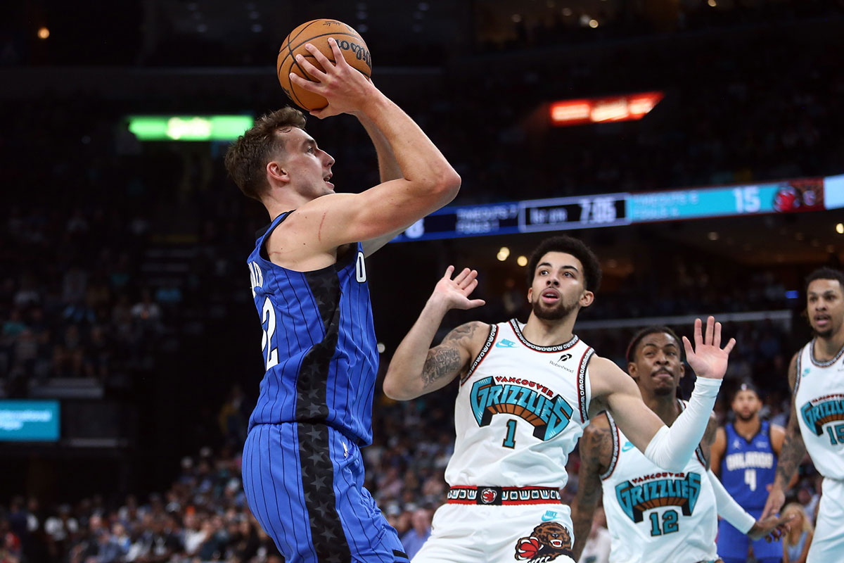 Orlando Magic forward Franz Wagner (22) shoots as Memphis Grizzlies guard Scotty Pippen Jr. (1) defends during the first half at FedExForum.