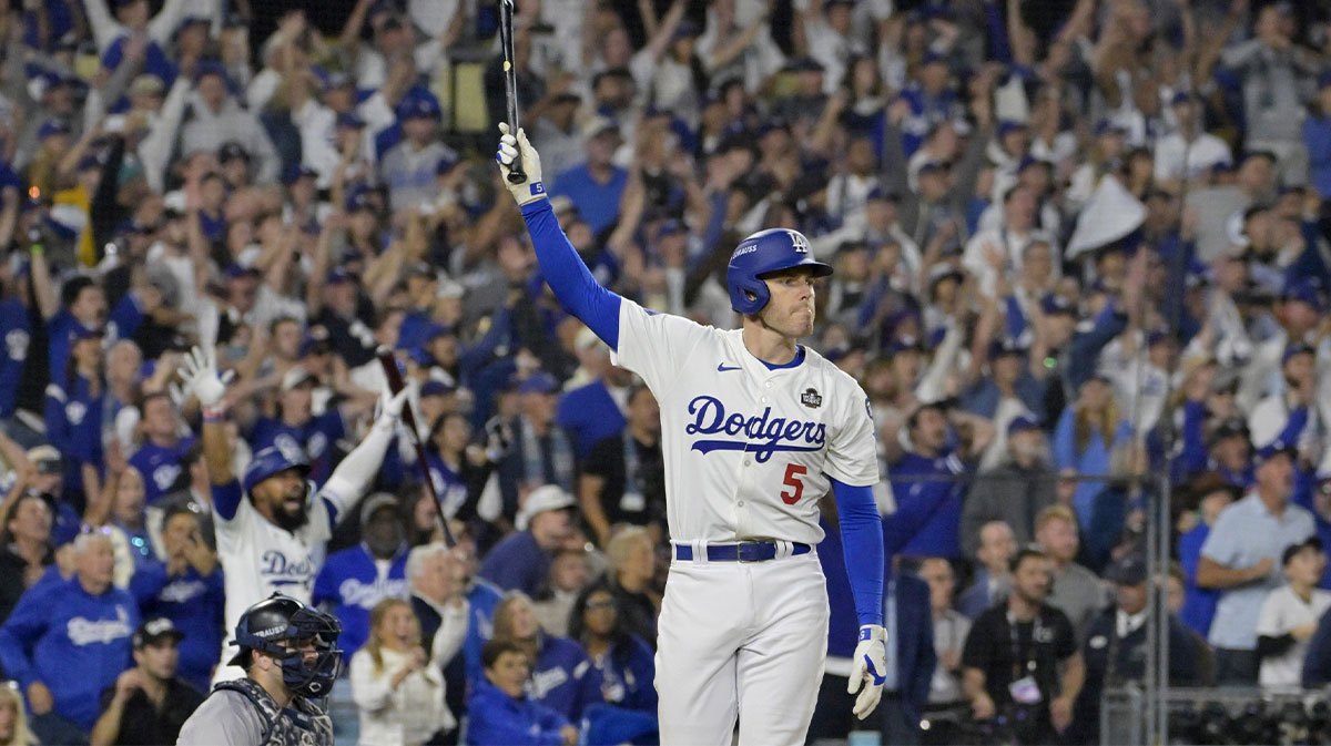 Los Angeles Dodgers first baseman Freddie Freeman (5) celebrates after hitting a grand slam home run in the tenth inning against the New York Yankees during game one of the 2024 MLB World Series at Dodger Stadium. 