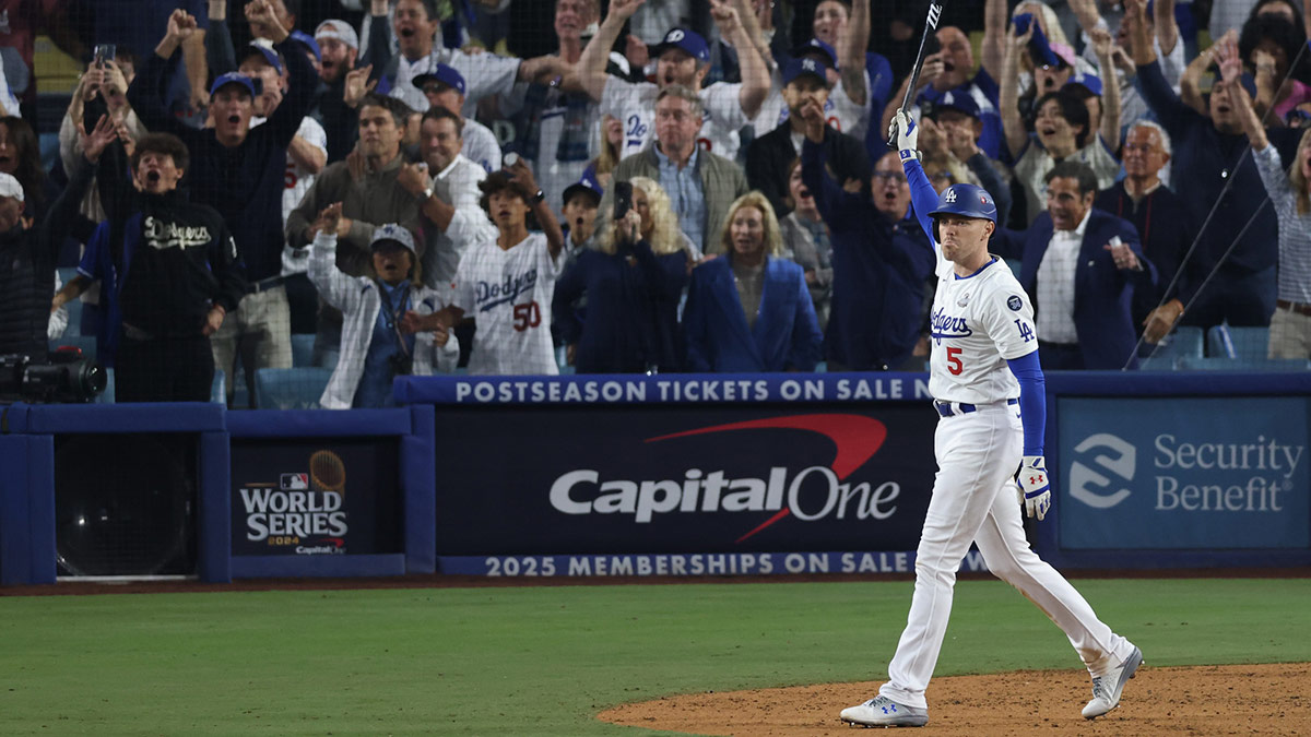 Los Angeles Dodgers first baseman Freddie Freeman (5) runs the bases after hitting a grand slam in the tenth inning against the New York Yankees during game one of the 2024 MLB World Series at Dodger Stadium.