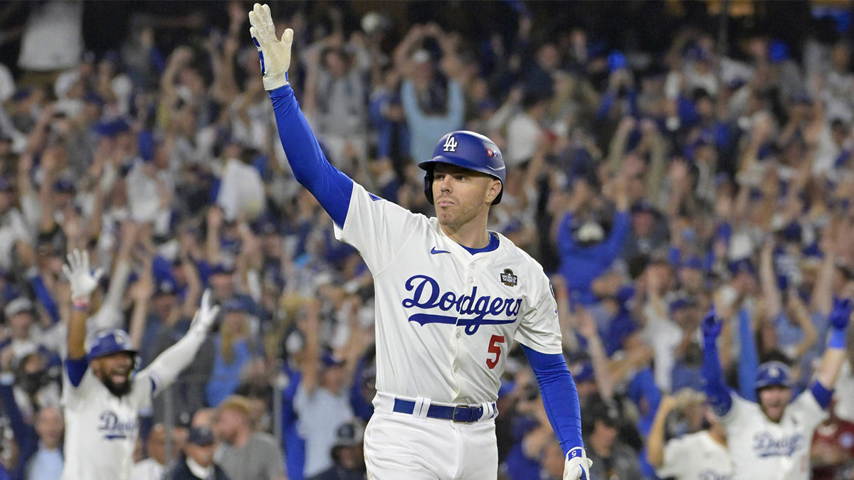 Los Angeles Dodgers first baseman Freddie Freeman (5) celebrates after hitting a grand slam home run in the tenth inning against the New York Yankees during game one of the 2024 MLB World Series at Dodger Stadium. 