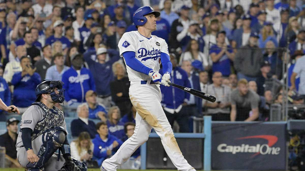 Los Angeles Dodgers first baseman Freddie Freeman (5) hits a grand slam home run in the tenth inning against the New York Yankees during game one of the 2024 MLB World Series at Dodger Stadium. 