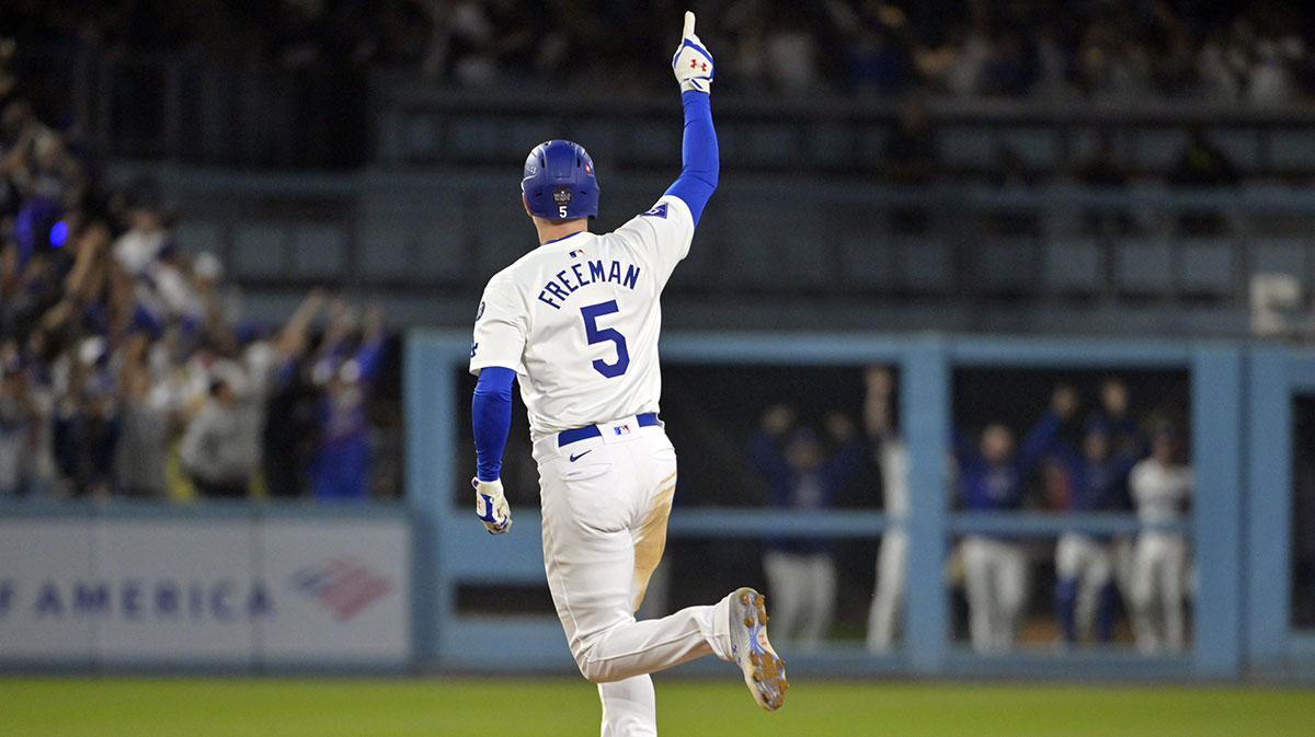 Los Angeles Dodgers first baseman Freddie Freeman (5) runs after hitting a grand slam home run in the tenth inning against the New York Yankees during game one of the 2024 MLB World Series at Dodger Stadium.