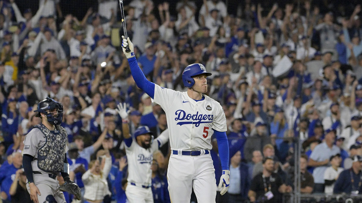 Los Angeles Dodgers first baseman Freddie Freeman (5) celebrates after hitting a grand slam home run in the tenth inning against the New York Yankees during game one of the 2024 MLB World Series at Dodger Stadium.