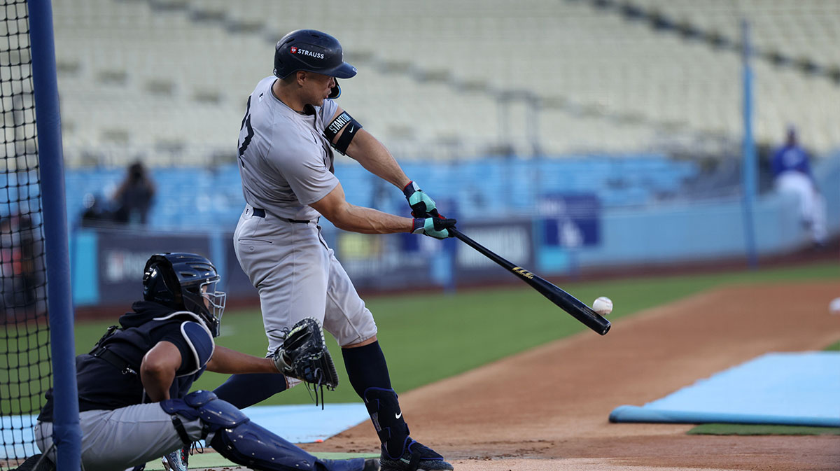 New York Yankees designated hitter Giancarlo Stanton (27) takes live batting practice during workout day at Dodgers Stadium