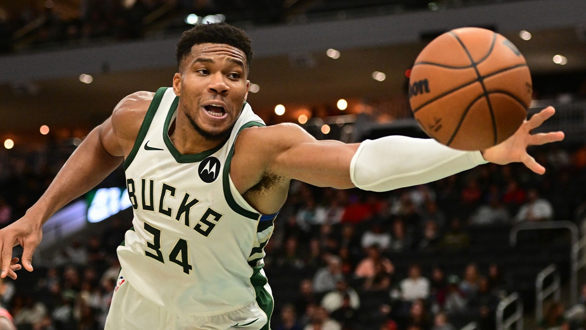 Oct 14, 2024; Milwaukee, Wisconsin, USA; Milwaukee Bucks forward Giannis Antetokounmpo (34) reaches for a loose ball in the second quarter against the Chicago Bulls at Fiserv Forum.