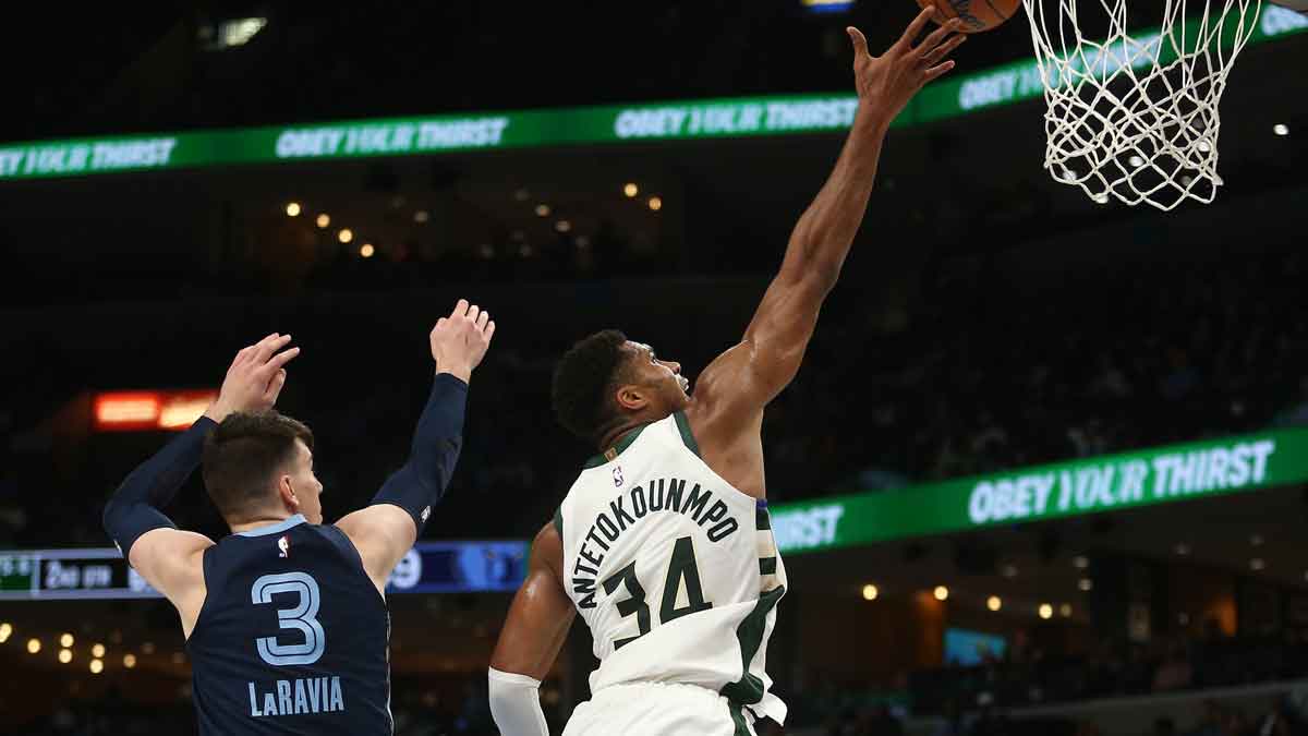 Milwaukee Bucks forward Giannis Antetokounmpo (34) drives to the basket as Memphis Grizzlies forward Jake LaRavia (3) and guard Ja Morant (12) defends during the first half at FedExForum.