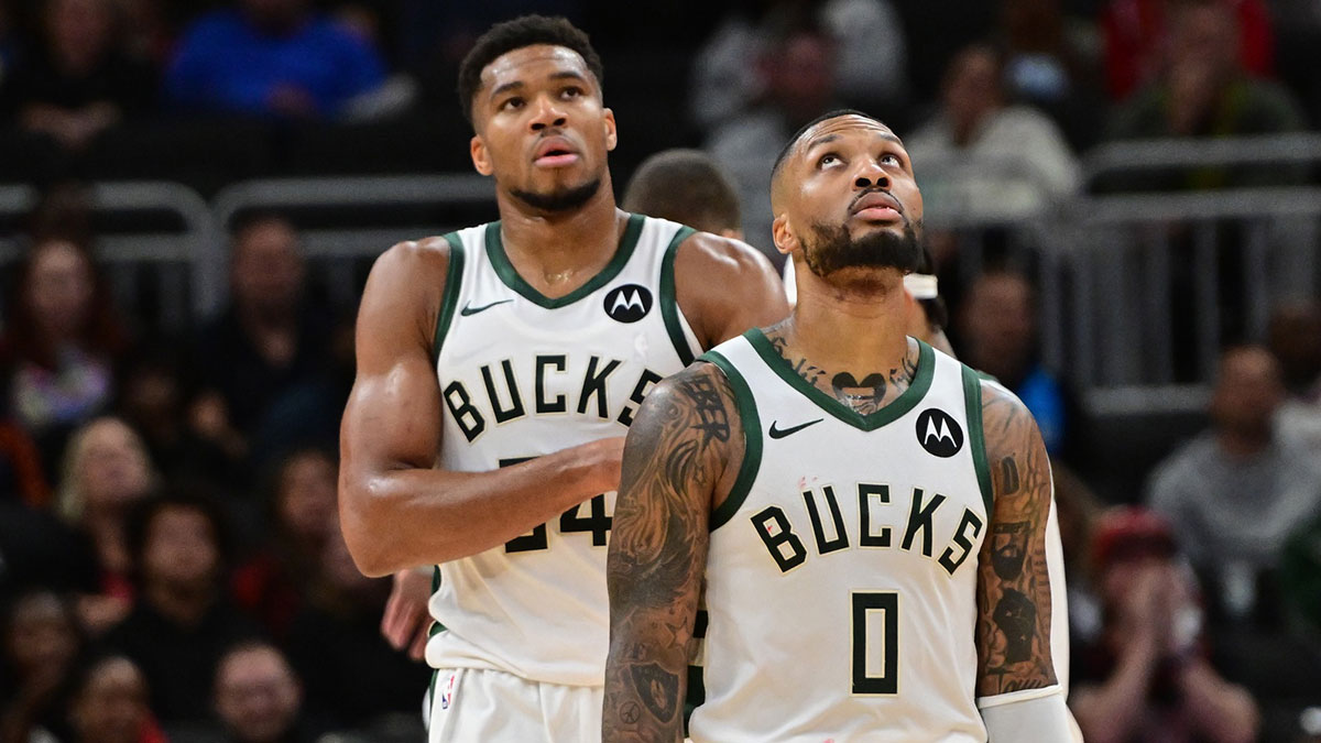 Milwaukee Bucks forward Giannis Antetokounmpo (34) and guard Damian Lillard (0) look on in the second quarter against the Chicago Bulls at Fiserv Forum.