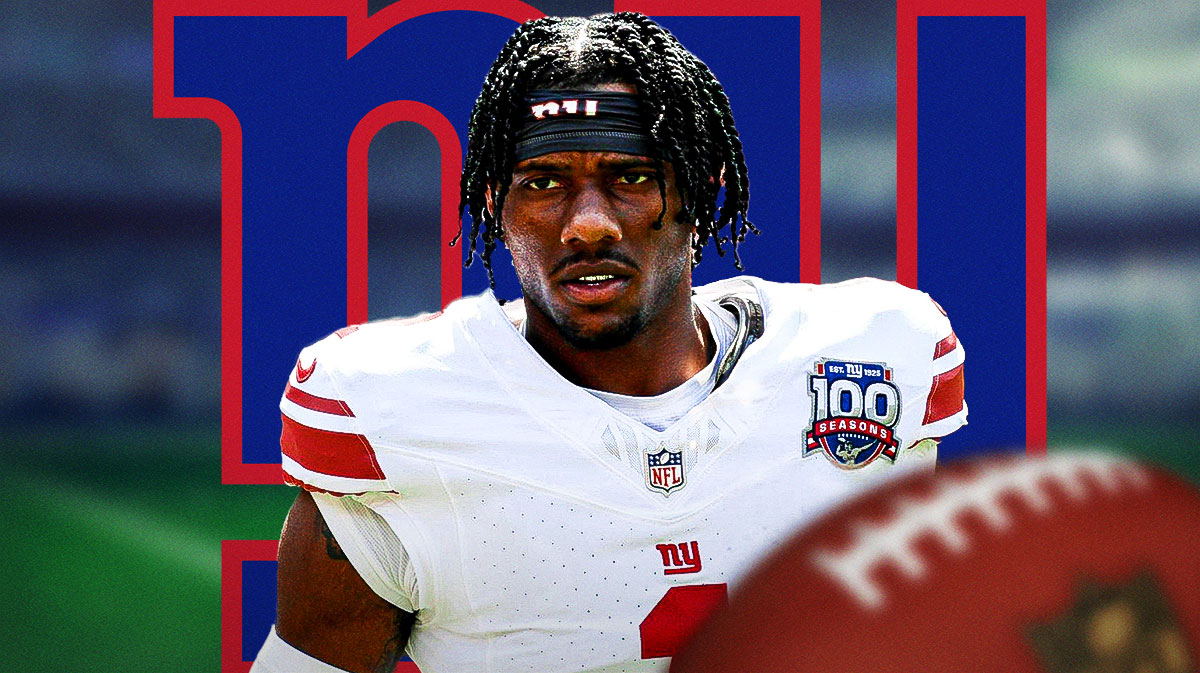 Malik Nabers helmet off serious face with Giants logo.