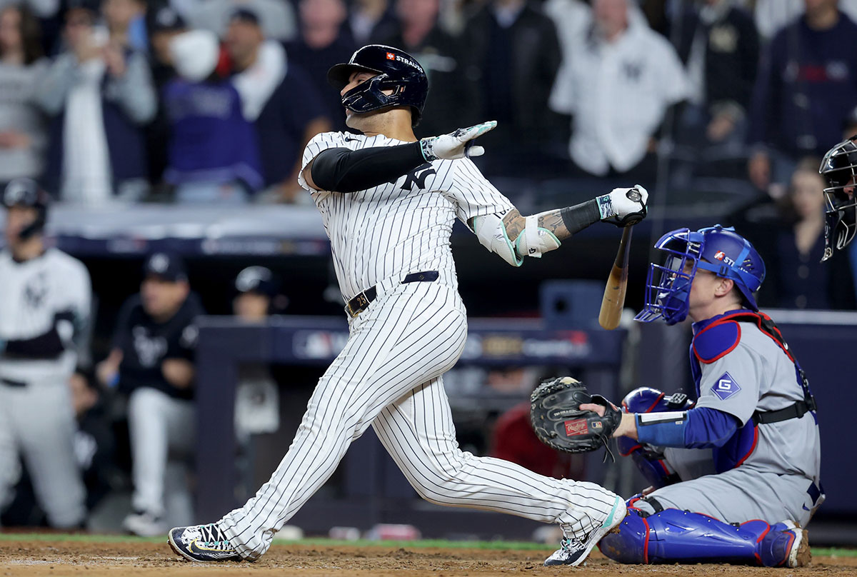 New York Yankees second baseman Gleyber Torres (25) hits a three-run home run during the eighth inning against the Los Angeles Dodgers in game four of the 2024 MLB World Series at Yankee Stadium