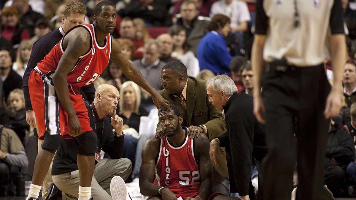 Portland Trailblazers center Greg Oden (52) sits on the floor after an injury at the Rose Garden. Oden was carried out on a stretcher.