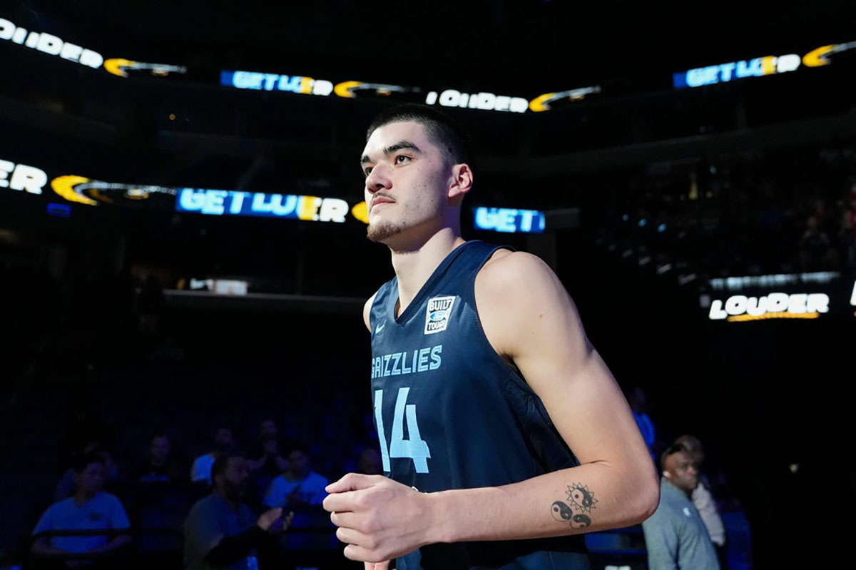 Grizzlies' Zach Edey (14) runs on the court as he is introduced during open practice at FedExForum in Memphis, Tenn., on Sunday, October 6, 2024. Edey scored 10 points and collected five rebounds against the Charlotte Hornets.