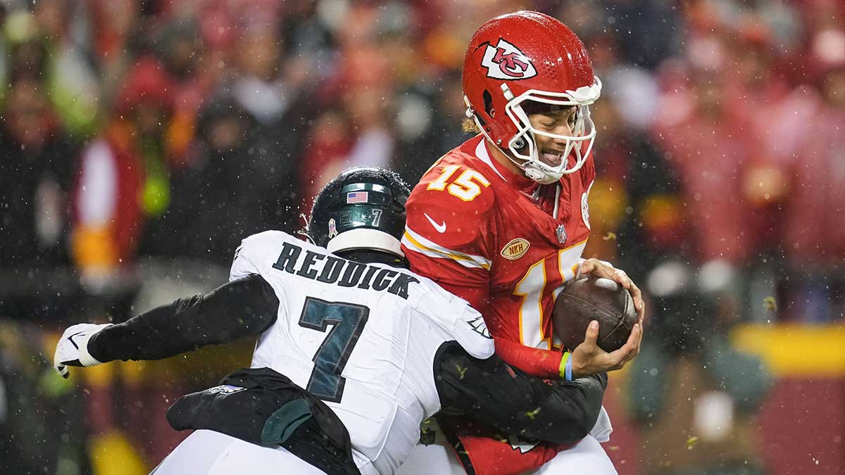Nov 20, 2023; Kansas City, Missouri, USA; Kansas City Chiefs quarterback Patrick Mahomes (15) is sacked by Philadelphia Eagles linebacker Haason Reddick (7) during the first half at GEHA Field at Arrowhead Stadium.