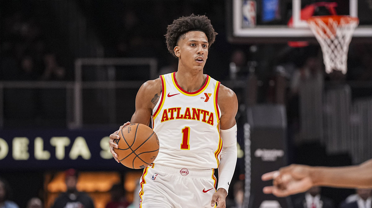 Atlanta Hawks forward Jalen Johnson (1) brings the ball up the court against the Indiana Pacers during the first half at State Farm Arena.