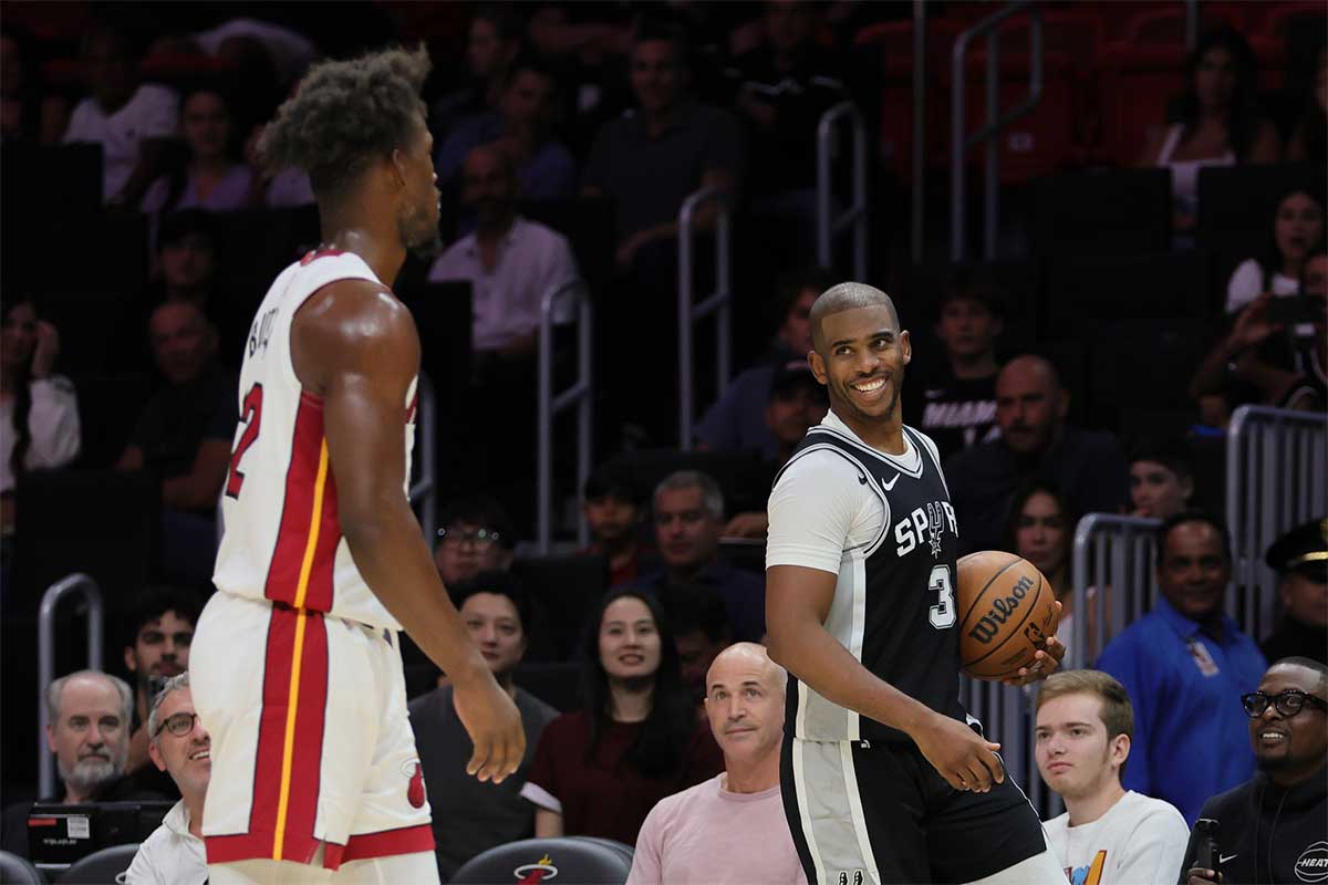 San Antonio Spurs guard Chris Paul (3) reacts toward Miami Heat forward Jimmy Butler (22) during the second quarter at Kaseya Center