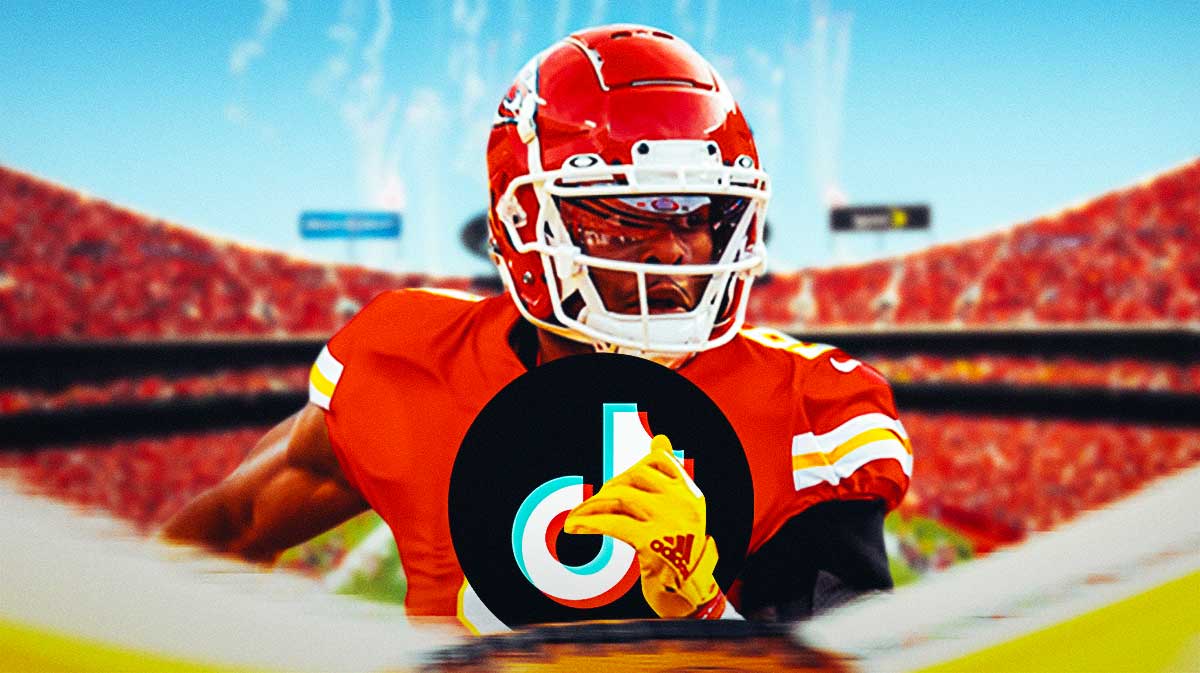 JuJu Smith-Schuster (Chiefs) catching a ball but replace the ball with TikTok logo