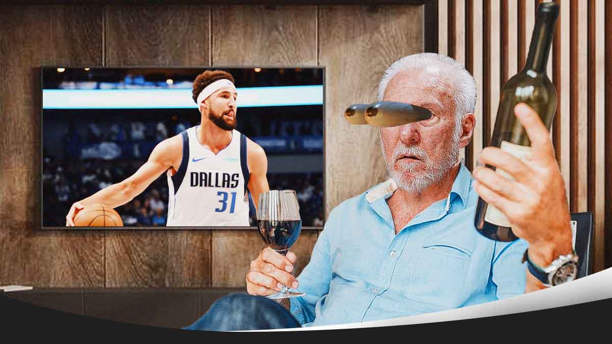 Spurs Gregg Popovich holding a glass of wine and sitting on a couch watching TV. Have his eyes popping out looking at the TV. On the TV, place Klay Thompson in a Mavericks jersey.