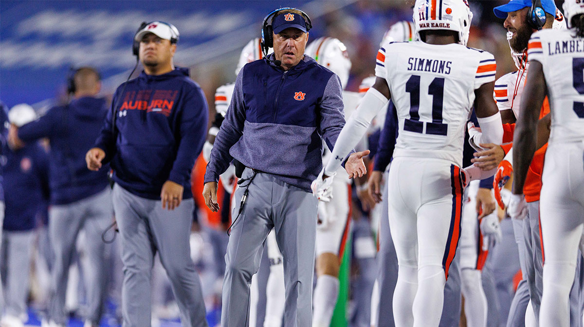 Auburn Tigers head coach Hugh Freeze fives Auburn Tigers wide receiver Malcolm Simmons (11) during the second quarter against the Kentucky Wildcats at Kroger Field.