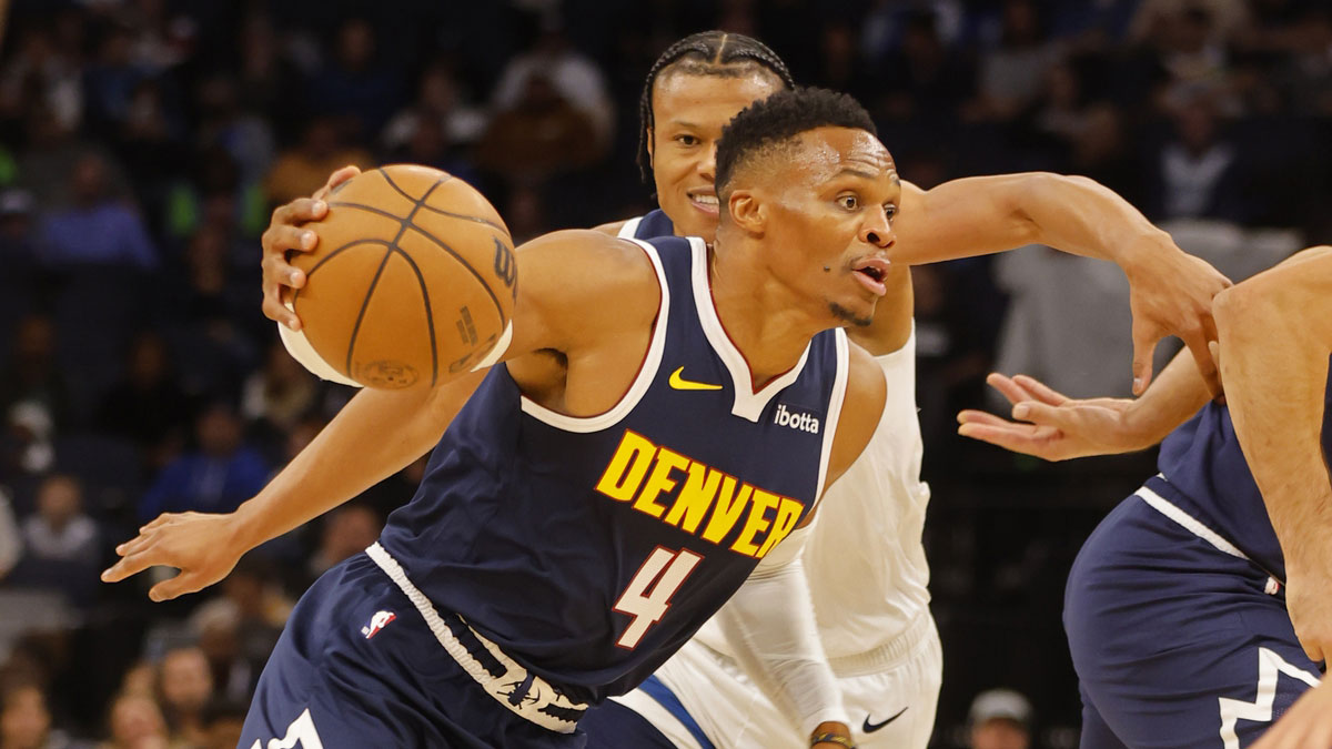 Denver Nuggets guard Russell Westbrook (4) works past Minnesota Timberwolves guard Jaylen Clark (22) in the first quarter at Target Center.