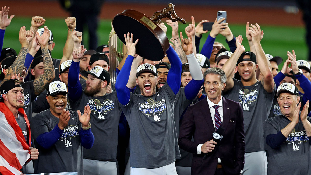 Los Angeles Dodgers first baseman Freddie Freeman (5) celebrates with the Willie Mays World Series Most Valuable Player Award after being name the MVP in game four to win the 2024 MLB World Series against the New York Yankees at New York.