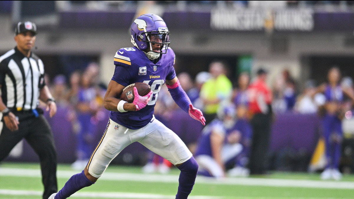 Minnesota Vikings wide receiver Justin Jefferson (18) runs the ball against the Detroit Lions during the fourth quarter at U.S. Bank Stadium.
