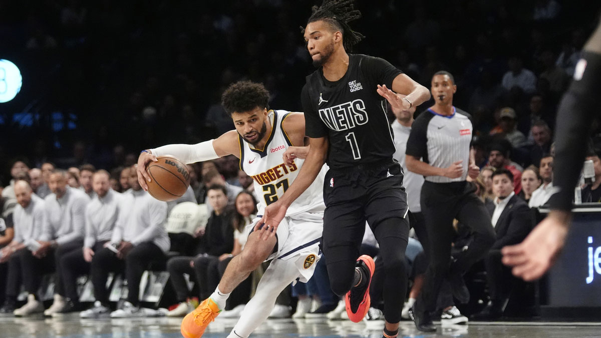 Denver Nuggets point guard Jamal Murray (27) dribbles the ball against Brooklyn Nets forward Ziaire Williams (1) during the first half of the game at Barclays Center.