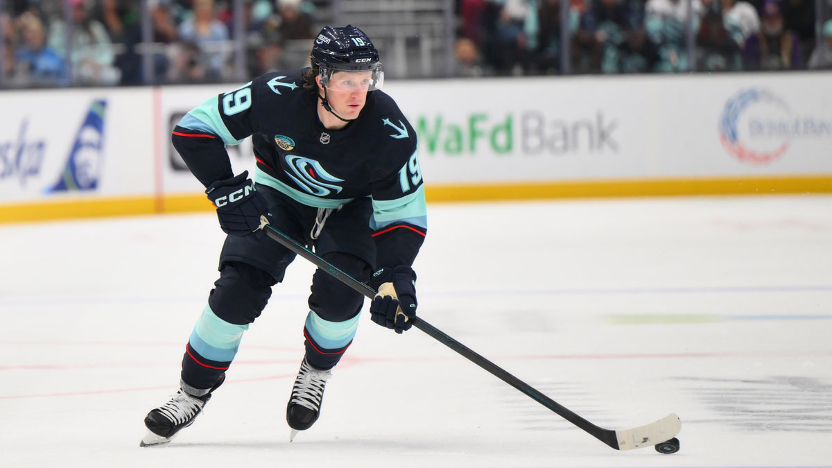 Seattle Kraken left wing Jared McCann (19) advances the puck against the Carolina Hurricanes during the first period at Climate Pledge Arena.