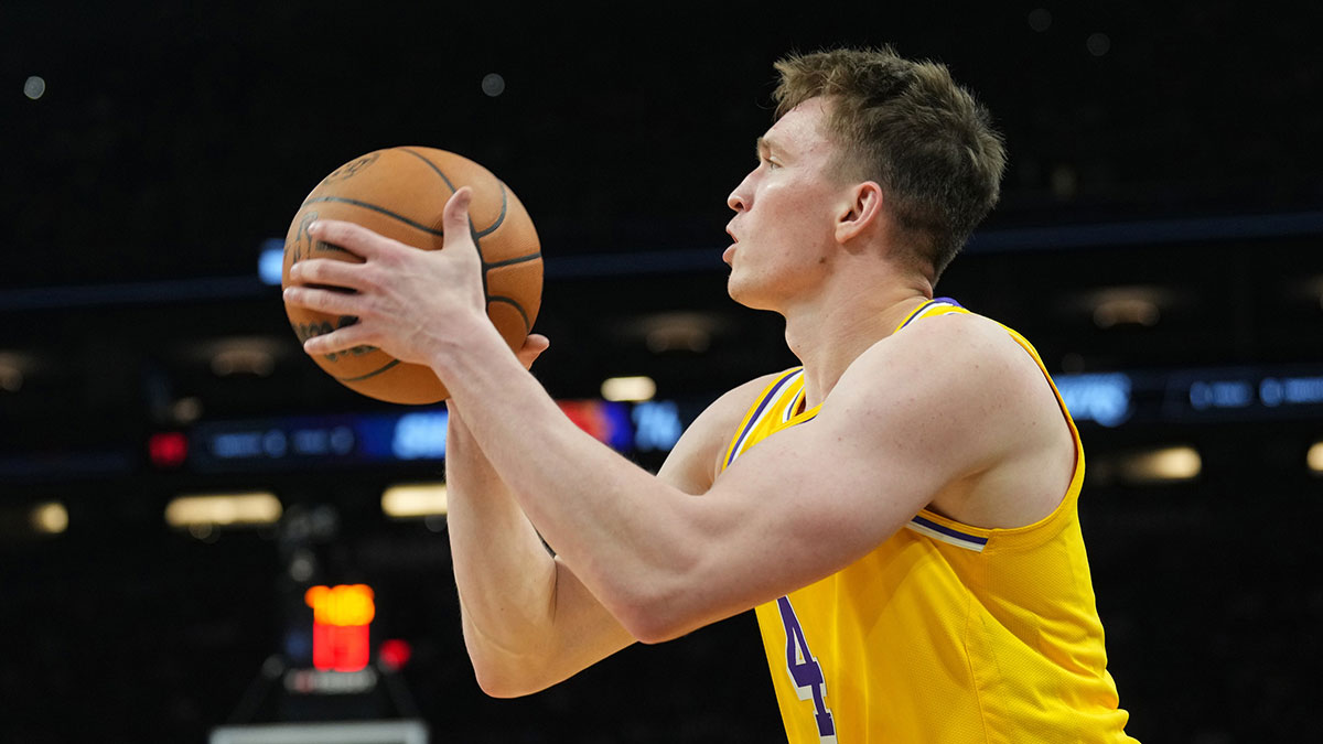 Los Angeles Lakers guard Dalton Knecht (4) shoots against the Phoenix Suns during the second half at Footprint Center.