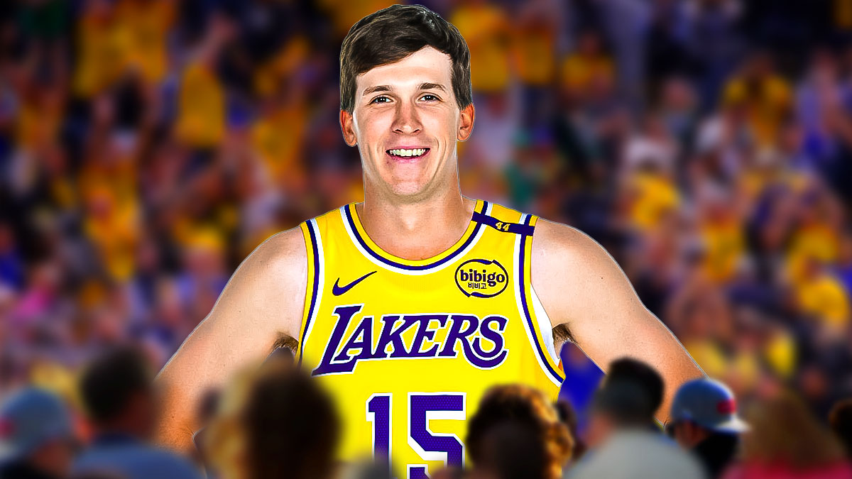Thumb: LA Lakers player Austin Reaves with the Lakers arena in the background, offense defense