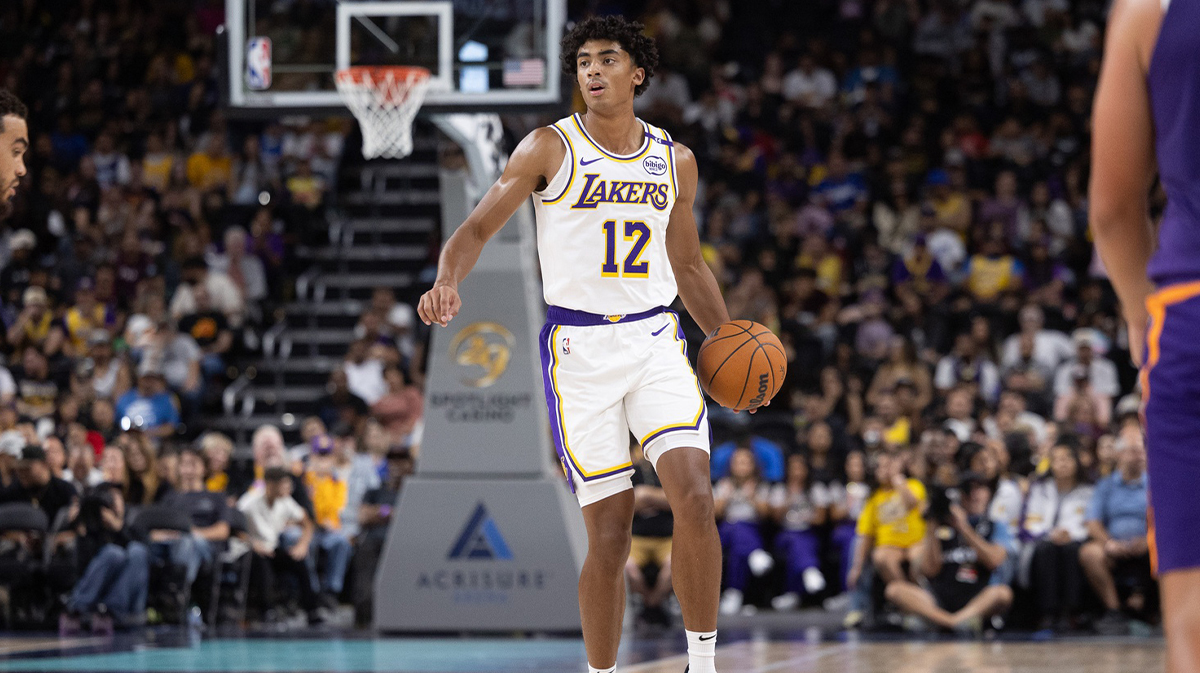 Los Angeles Lakers guard Max Christie (12) moves the ball against the Phoenix Suns during the second half at Acrisure Arena.