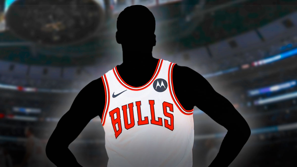 A shadowy player in a Chicago Bulls jersey with the Chicago Bulls arena in the background, roster decision EJ Liddell