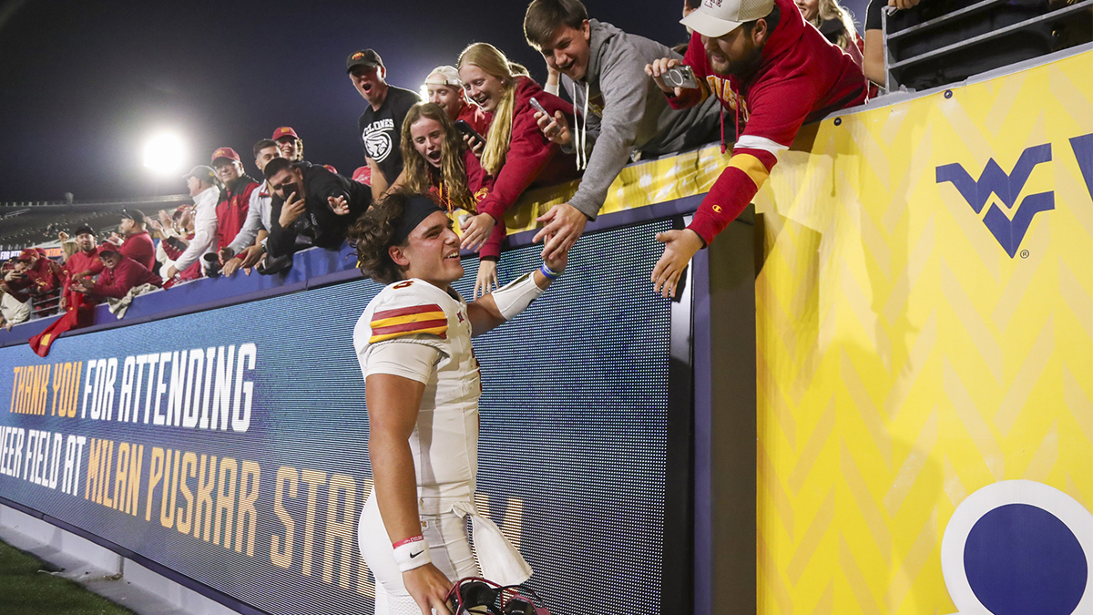 Iowa State Cyclones quarterback Rocco Becht (3) celebrates with fans after defeating the West Virginia Mountaineers at Mountaineer Field at Milan Puskar Stadium.