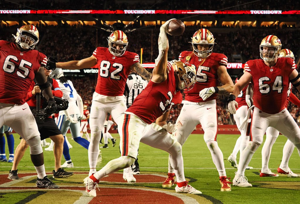 San Francisco 49ers running back Isaac Guerendo (31) spikes the ball after scoring a touchdown against the Dallas Cowboys during the third quarter at Levi's Stadium.