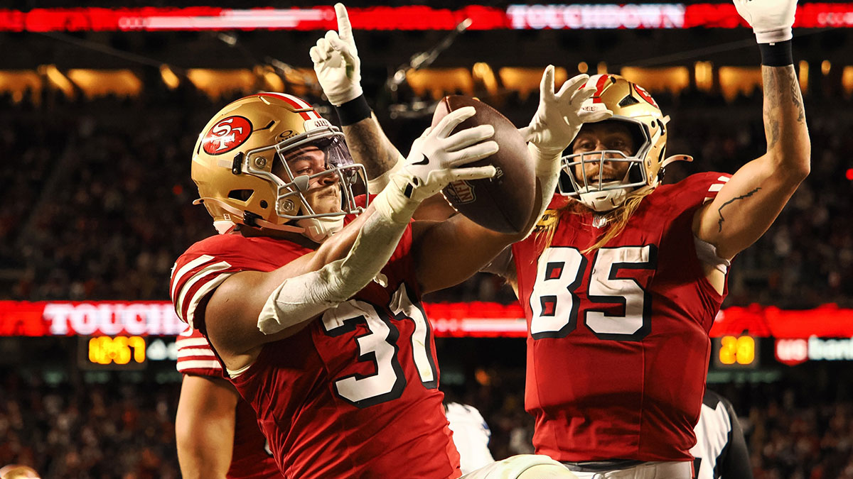 San Francisco 49ers running back Isaac Guerendo (31) celebrates with San Francisco 49ers tight end George Kittle (85) after scoring a touchdown against the Dallas Cowboys during the third quarter at Levi's Stadium.