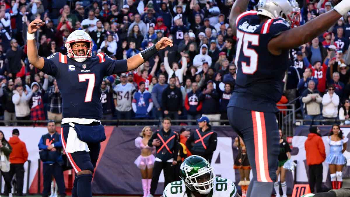 New England Patriots quarterback Jacoby Brissett (7) reacts after a touchdown against the New York Jets during the second half at Gillette Stadium.