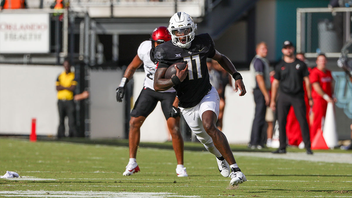 UCF Knights quarterback Jacurri Brown (11) runs the ball during the second quarter against the Cincinnati Bearcats at FBC Mortgage Stadium.