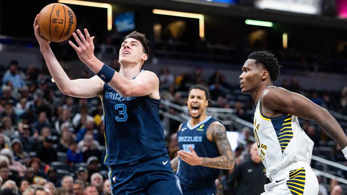 Memphis Grizzlies forward Jake LaRavia (3) shoots the ball while Indiana Pacers guard Bennedict Mathurin (00) defends in the first half at Gainbridge Fieldhouse.