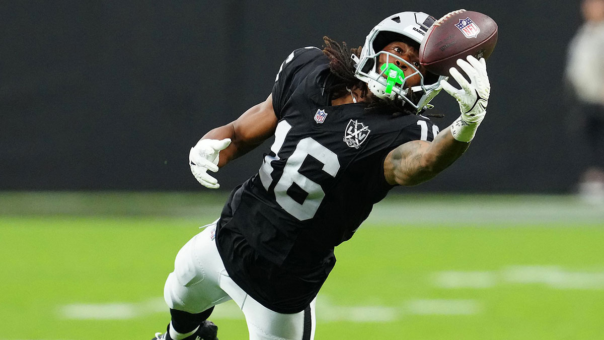 Sep 29, 2024; Paradise, Nevada, USA; Las Vegas Raiders wide receiver Jakobi Meyers (16) attempts to make a catch against the Cleveland Browns during the third quarter at Allegiant Stadium.