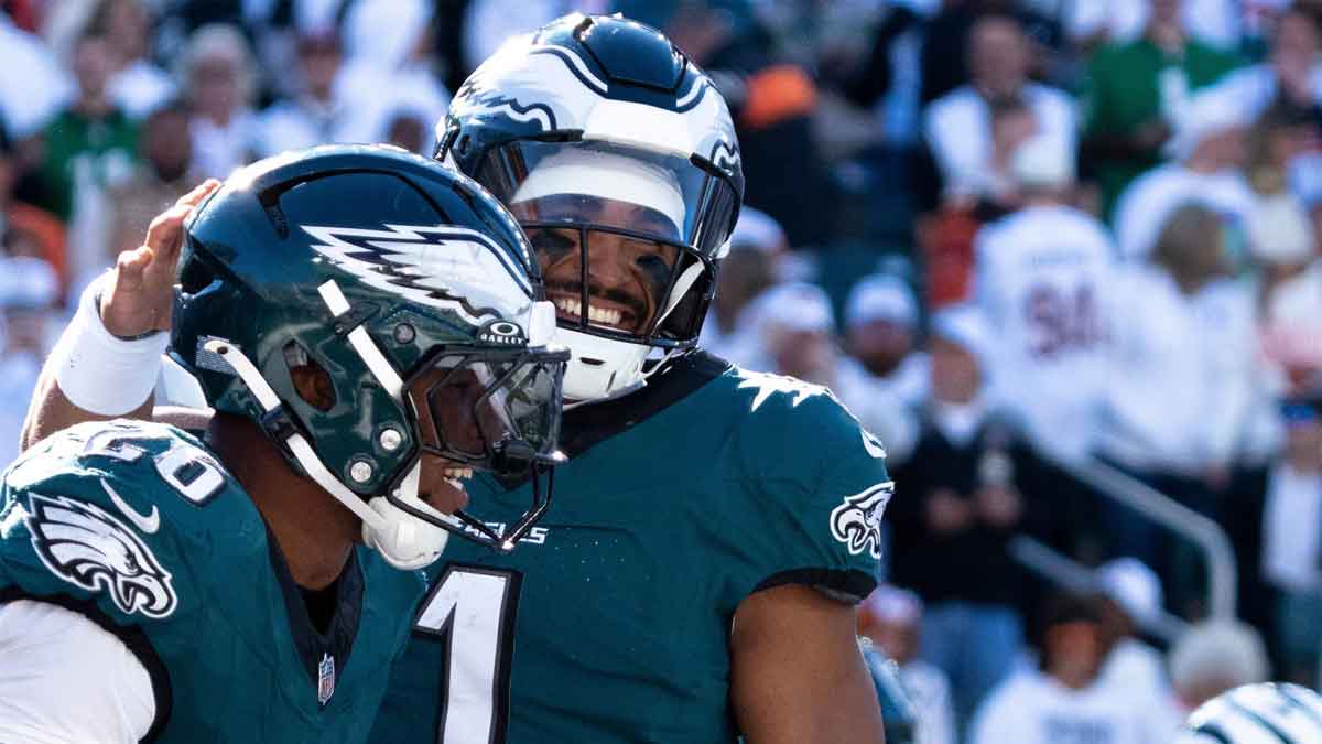 Philadelphia Eagles quarterback Jalen Hurts (1) reacts to scoring a touchdown with Philadelphia Eagles running back Saquon Barkley (26) in the fourth quarter of the NFL game against the Cincinnati Bengals at Paycor Stadium in Cincinnati on Sunday, Oct. 27, 2024.