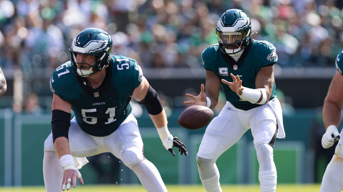 Philadelphia Eagles center Cam Jurgens (51) throws the ball to quarterback Jalen Hurts (1) in the game against the Cleveland Browns at Lincoln Financial Field.