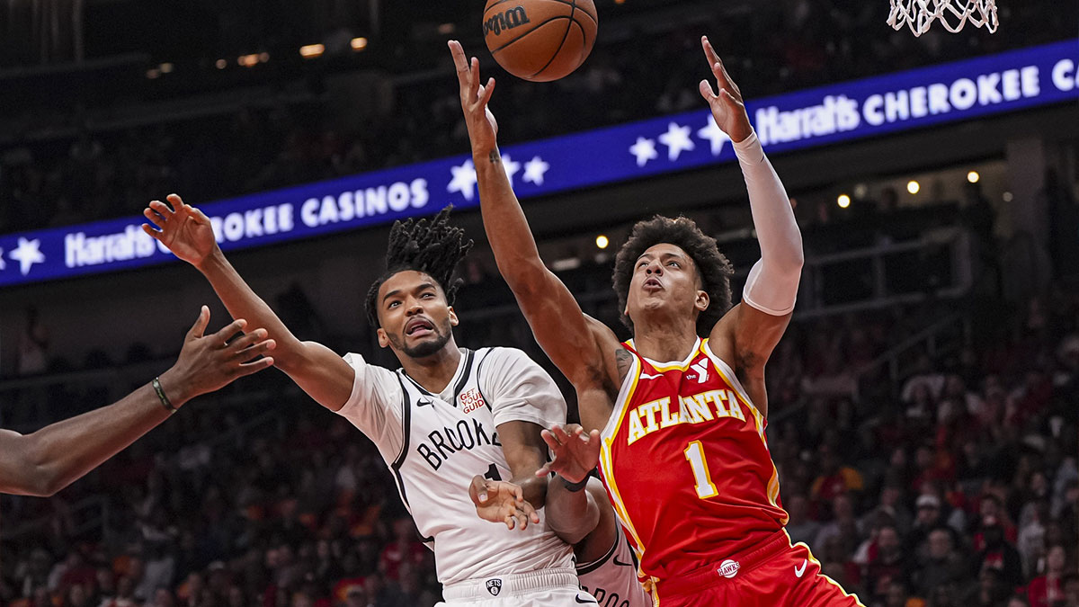 Brooklyn Nets forward Ziaire Williams (1) and Atlanta Hawks forward Jalen Johnson (1) fight for a rebound during the first half at State Farm Arena.