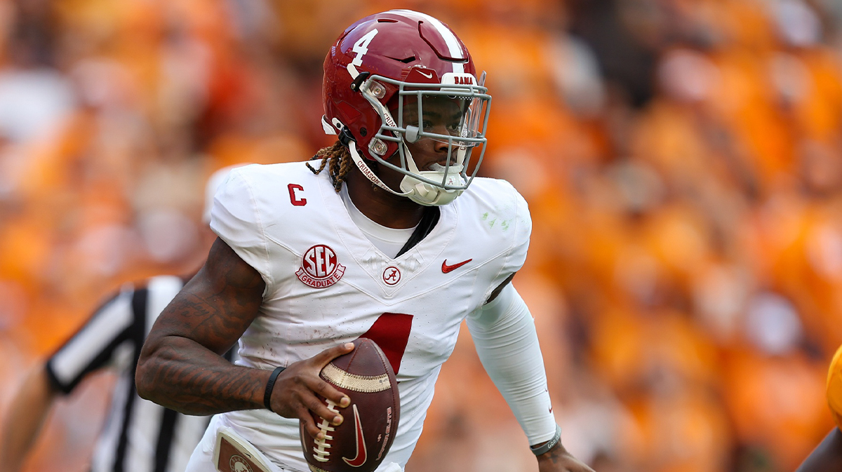 Alabama Crimson Tide quarterback Jalen Milroe (4) scrambles against the Tennessee Volunteers during the second quarter at Neyland Stadium.